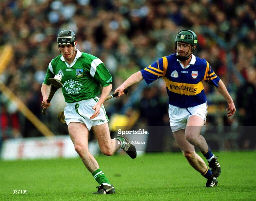 30 April 2000; Mark Keane of Limerick in action against David Kennedy of Tipperary during the Church & General National Hurling League Division 1 Semi-Final match between Tipperary and Limerick at Semple Stadium in Thurles, Tipperary. Photo by Ray McManus/Sportsfile