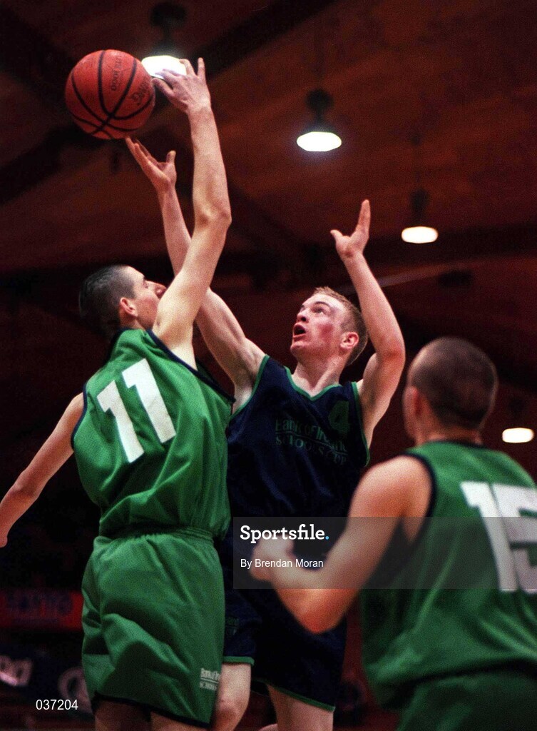 9 February 2000; Mark McEvoy of Carrick-On-Shannon CS in action against Christopher O'Sullivan, left, and Neil Hanley of Colaiste Mhuire Crosshaven during the Bank of Ireland Schools Cup Boys' C Final match between Colaiste Mhuire Crosshaven and Carrick-On-Shannon CS at National Basketball Arena in Tallaght, Dublin. Photo by Brendan Moran/Sportsfile