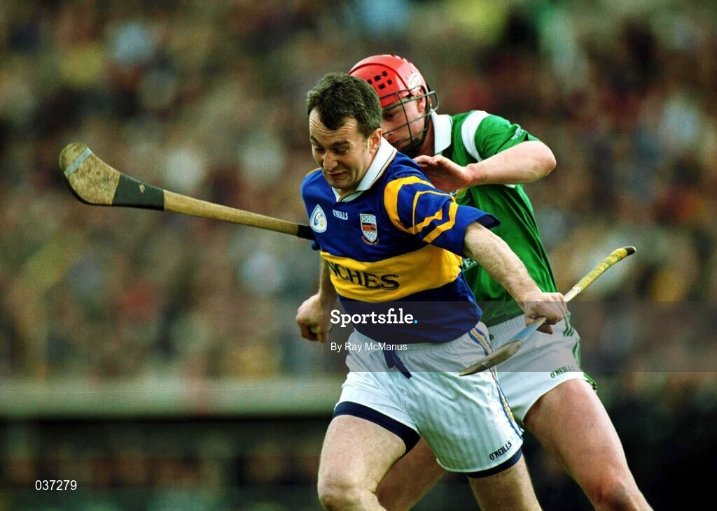 30 April 2000; Michael Ryan of Tipperary in action against Brian Begley of Limerick during the Church & General National Hurling League Division 1 Semi-Final match between Tipperary and Limerick at Semple Stadium in Thurles, Tipperary. Photo by Ray McManus/Sportsfile