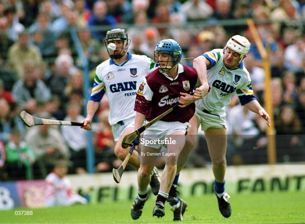 30 April 2000; Ollie Canning of Galway is tackled by Fergal Hartley, right, and Tom Feeney of Waterford during the Church & General National Hurling League Division 1 Semi-Final match between Galway and Waterford at Semple Stadium in Thurles, Tipperary. Photo by Damien Eagers/Sportsfile