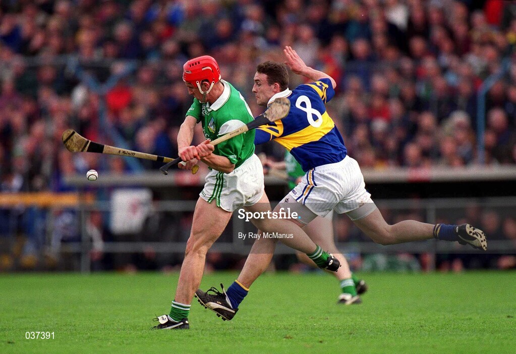 30 April 2000; Andy Moloney of Tipperary in action against Ollie Moran of Limerick during the Church & General National Hurling League Division 1 Semi-Final match between Tipperary and Limerick at Semple Stadium in Thurles, Tipperary. Photo by Ray McManus/Sportsfile