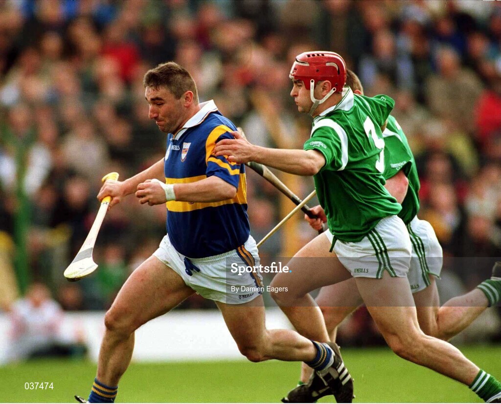 30 April 2000; Paul Shelley of Tipperary in action against TJ Ryan and Stephen McDonagh of Limerick during the Church & General National Hurling League Division 1 Semi-Final match between Tipperary and Limerick at Semple Stadium in Thurles, Tipperary. Photo by Damien Eagers/Sportsfile