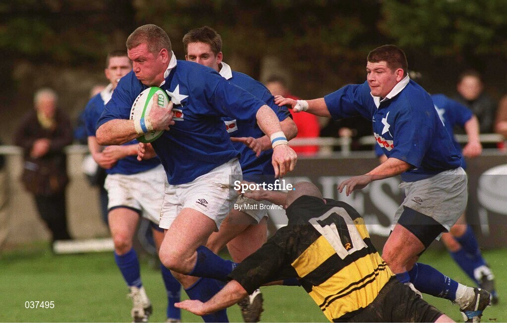 26 February 2000; Victor Costello St Mary's is tackled by Eamon Buckley of Young Munster during the AIB League Division 1 match between St Mary's and Young Munster at Templeville Road in Dublin. Photo by Matt Browne/Sportsfile