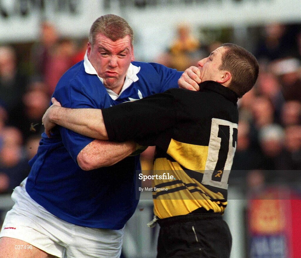 26 February 2000; Victor Costello of St Mary's is tackled by Leo Buckley of Young Munster during the AIB League Division 1 match between St Mary's and Young Munster at Templeville Road in Dublin. Photo by Matt Browne/Sportsfile