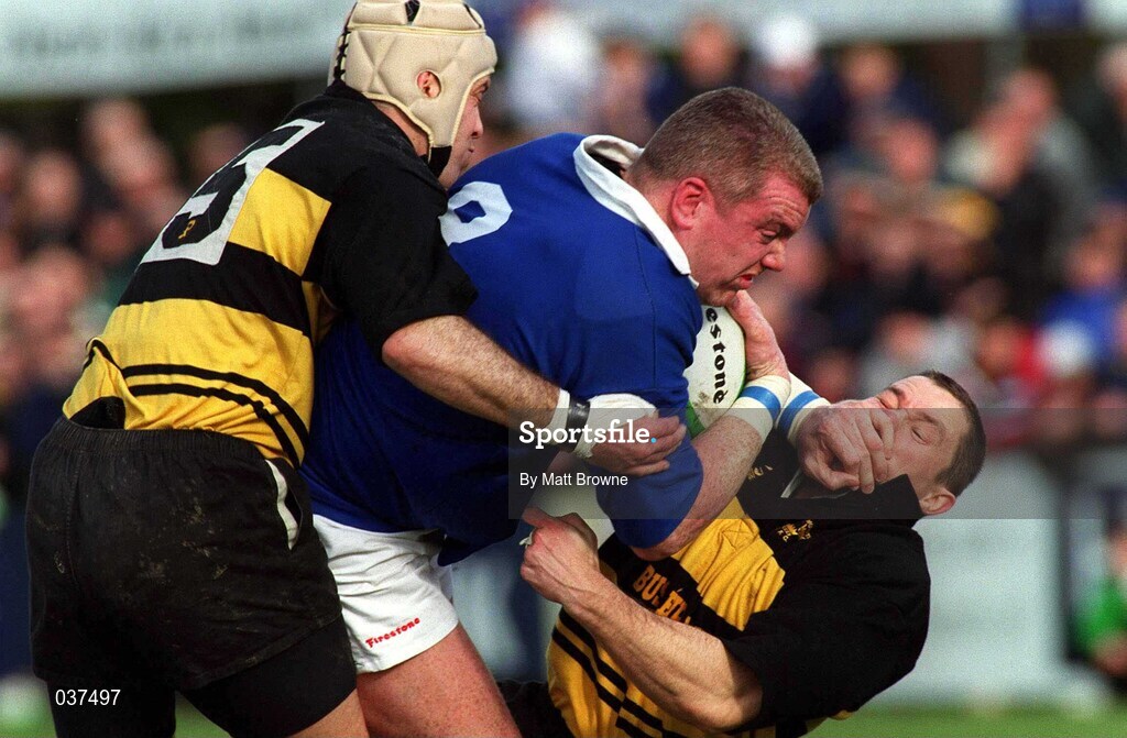 26 February 2000; Victor Costello of St. Mary's is tackled by Paul O'Donnell and Leo Doyle of Young Munster during the AIB League Division 1 match between St Mary's and Young Munster at Templeville Road in Dublin. Photo by Matt Browne/Sportsfile