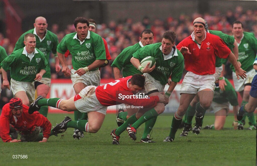 1 April 2000; Ronan O'Gara of Ireland is tackled by Ian Gibbs of Wales during the Lloyds TSB 6 Nations match between Ireland and Wales at Lansdowne Road in Dublin. Photo by Matt Browne/Sportsfile
