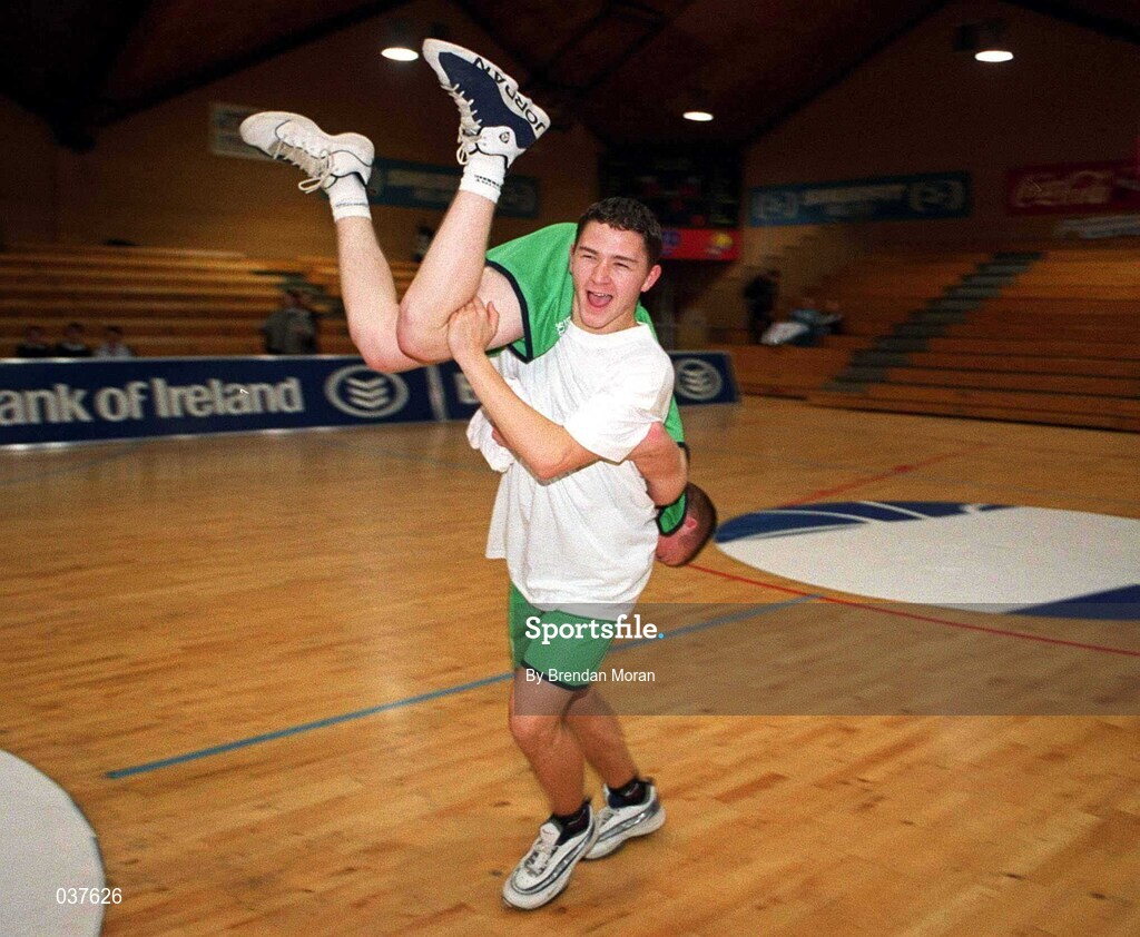 9 February 2000; Sean Carey carries Andrew Buckley of Colaiste Muire Crosshaven following the Bank of Ireland Schools Cup Boys' C Final match between Colaiste Mhuire Crosshaven and Carrick-On-Shannon CS at National Basketball Arena in Tallaght, Dublin. Photo by Brendan Moran/Sportsfile