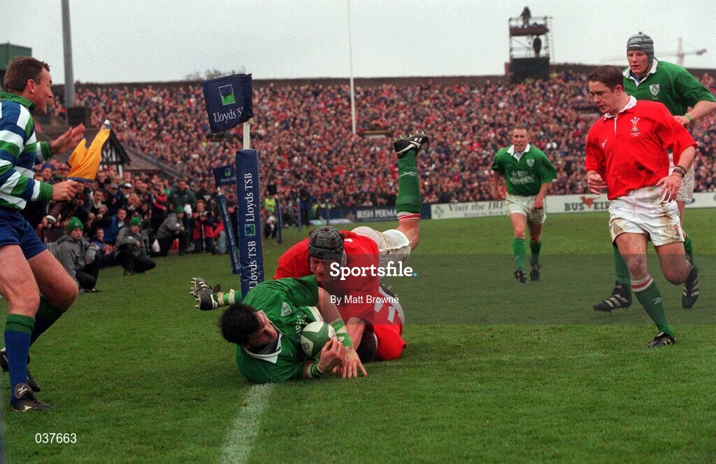 1 April 2000; Shane Horgan of Ireland goes over to score his side's first try despite the tackle of Andrew Moore of Wales during the Lloyds TSB 6 Nations match between Ireland and Wales at Lansdowne Road in Dublin. Photo by Matt Browne/Sportsfile