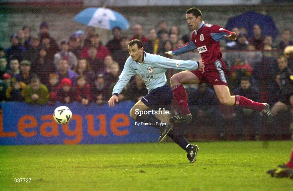 31 March 2000; Stephen Geoghegan of Shelbourne is tackled by Kieran Foley of Galway United during the FAI Cup Semi-Final match between Galway United and Shelbourne at Terryland Park in Galway. Photo by Damien Eagers/Sportsfile