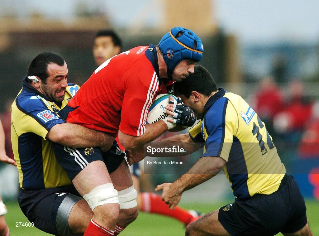 18 November 2007; Alan Quinlan, Munster, is tackled by Davit Zirakashvili, left, and Raphael Chanal, Clermont Auvergne. Heineken Cup, Pool 5, Round 2, Munster v Clermont Auvergne, Thomond Park, Limerick. Picture credit; Brendan Moran / SPORTSFILE