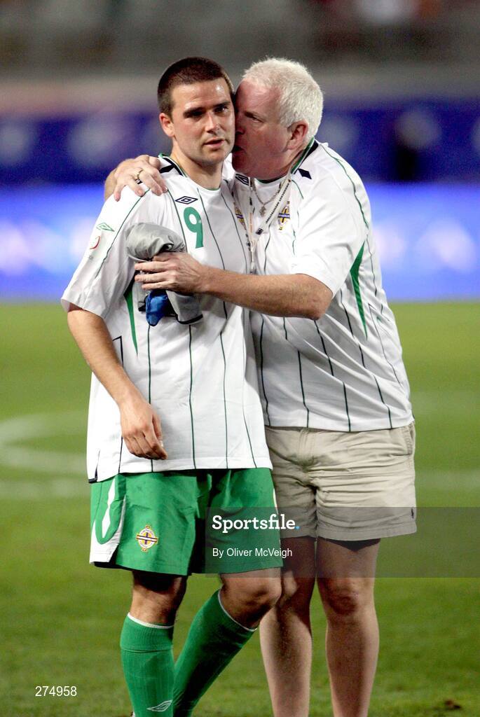 21 November 2007; David Healy, Northern Ireland, is consoled by a supporter at the end of the game. 2008 European Championship Qualifier, Spain v Northern Ireland, Estadio de Gran Canaria, Las Palmas, Spain. Picture credit; Oliver McVeigh / SPORTSFILE