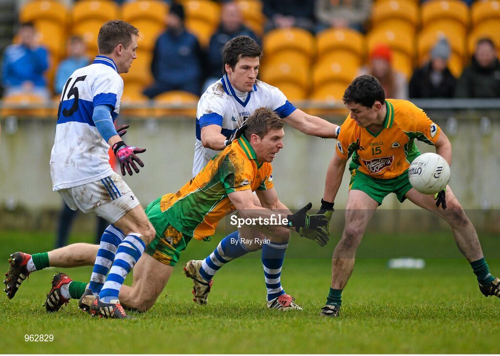 14 February 2015; Kieran McGrath, Corofin, gets the ball away  against Tomas Quinn and Brendan Egan, St Vincent's. AIB GAA Football All-Ireland Senior Club Championship, Semi-Final, Corofin v St Vincent's. O'Connor Park, Tullamore, Co. Offaly. Picture credit: Ray Ryan / SPORTSFILE