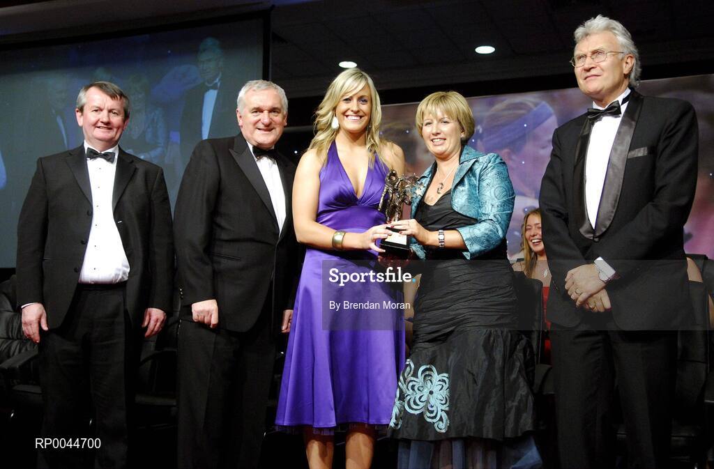 17 November 2007; Brid Stack, Cork, is presented with her Allstar award by Geraldine Giles, President, Cumann Peil na mBan, in the company of An Taoiseach Bertie Ahern, T.D, Pol O Callachoir, left, Ceannsai, TG4 and Tony Towell, O'Neills, at the 2007 O'Neills/TG4 Ladies Football All-Star Awards. Citywest Hotel, Conference, Leisure & Golf Resort, Saggart, Co. Dublin. Picture credit: Brendan Moran / SPORTSFILE  *** Local Caption ***