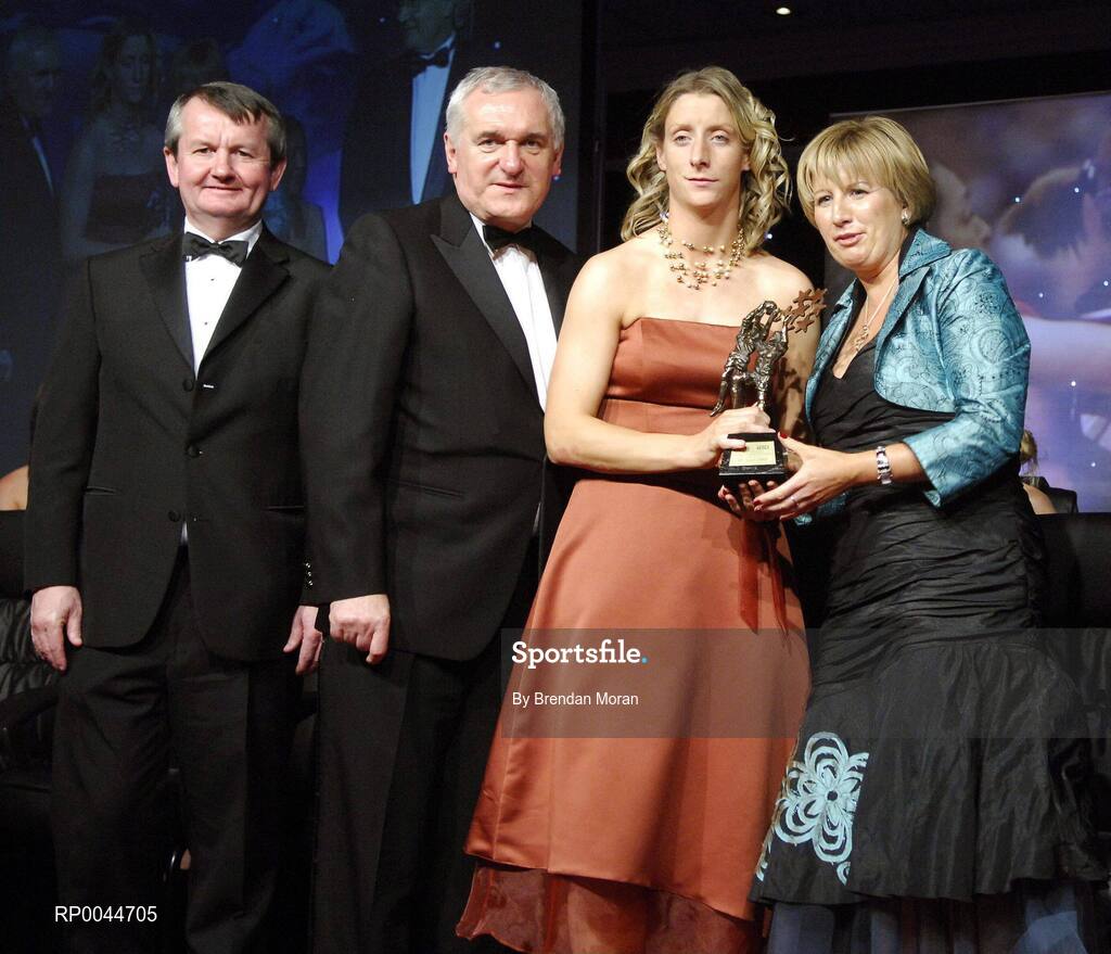 17 November 2007; Cora Staunton, Mayo, is presented with her Allstar award by Geraldine Giles, President, Cumann Peil na mBan, in the company of An Taoiseach Bertie Ahern, T.D, Pol O Callachoir, left, Ceannsai, TG4, at the 2007 O'Neills/TG4 Ladies Football All-Star Awards. Citywest Hotel, Conference, Leisure & Golf Resort, Saggart, Co. Dublin. Picture credit: Brendan Moran / SPORTSFILE  *** Local Caption ***