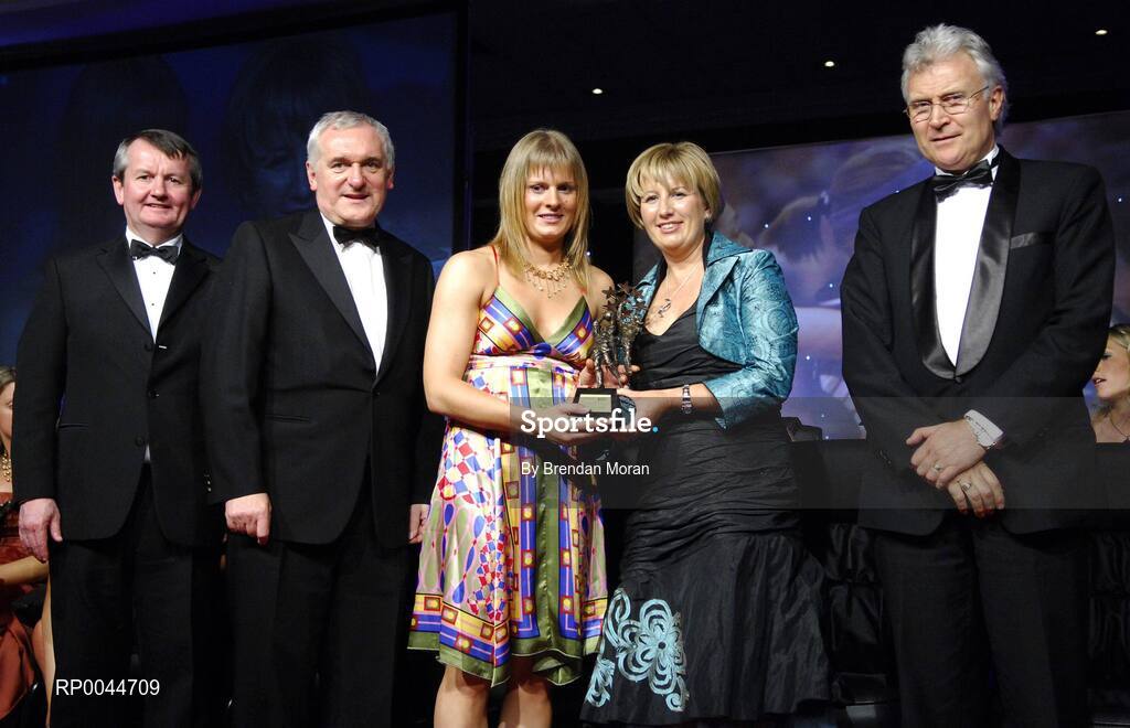 17 November 2007; Deirdre O'Reilly, Cork, is presented with her Allstar award by Geraldine Giles, President, Cumann Peil na mBan, in the company of An Taoiseach Bertie Ahern, T.D, Pol O Callachoir, left, Ceannsai, TG4 and Tony Towell, O'Neills, at the 2007 O'Neills/TG4 Ladies Football All-Star Awards. Citywest Hotel, Conference, Leisure & Golf Resort, Saggart, Co. Dublin. Picture credit: Brendan Moran / SPORTSFILE  *** Local Caption ***