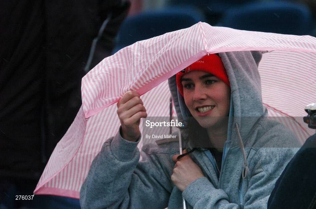 2 December 2007; A  Longford Town supporter shelters from the heavy rain before the start of the game. FAI Ford Cup Final, Cork City v Longford Town, RDS, Ballsbridge, Dublin. Picture credit; David Maher / SPORTSFILE