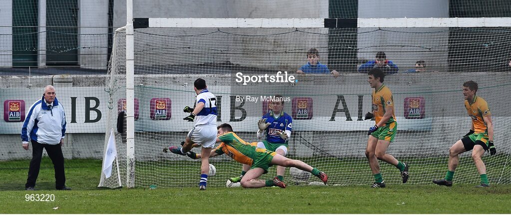 14 February 2015; Corofin's Cathal Silke, supported by goalkeeper Tom Healy and team mates Daithí Burke and Kieran Fitzgerald, moves to block a shot by Ruairí Treanor, St Vincent's, late in the game. AIB GAA Football All-Ireland Senior Club Championship, Semi-Final, Corofin v St Vincent's. O'Connor Park, Tullamore, Co. Offaly. Picture credit: Ray McManus / SPORTSFILE