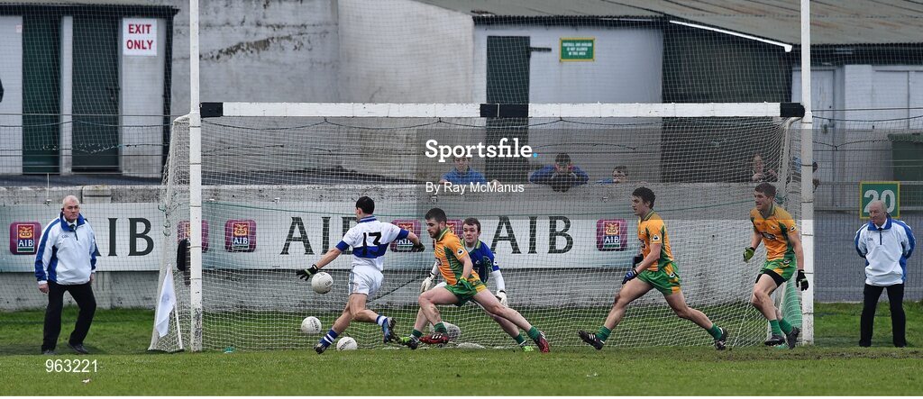 14 February 2015; Corofin's Cathal Silke, supported by goalkeeper Tom Healy and team mates Daithí Burke and Kieran Fitzgerald, moves to block a shot by Ruairí Treanor, St Vincent's, late in the game. AIB GAA Football All-Ireland Senior Club Championship, Semi-Final, Corofin v St Vincent's. O'Connor Park, Tullamore, Co. Offaly. Picture credit: Ray McManus / SPORTSFILE