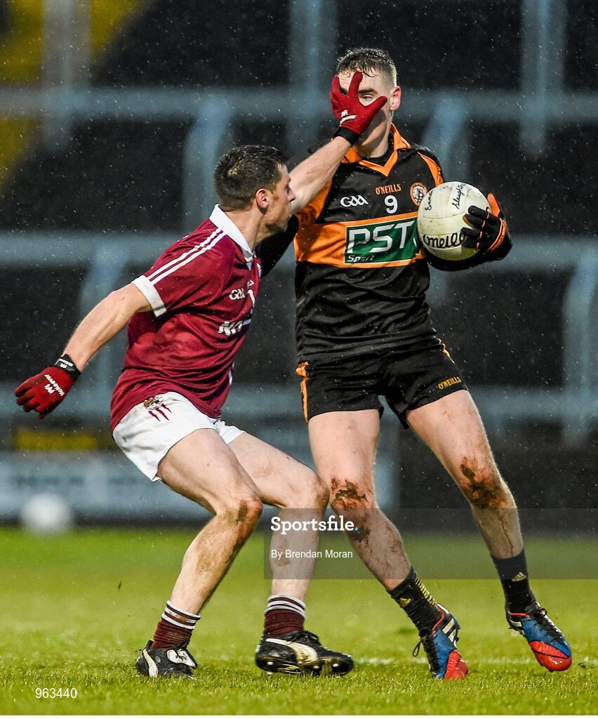 15 February 2015; Greg Horan, Austin Stacks, is tackled by Barry McGuigan, Slaughtneil. AIB GAA Football All-Ireland Senior Club Championship, Semi-Final, Austin Stacks v Slaughtneil, O'Moore Park, Portlaoise, Co. Laois. Picture credit: Brendan Moran / SPORTSFILE