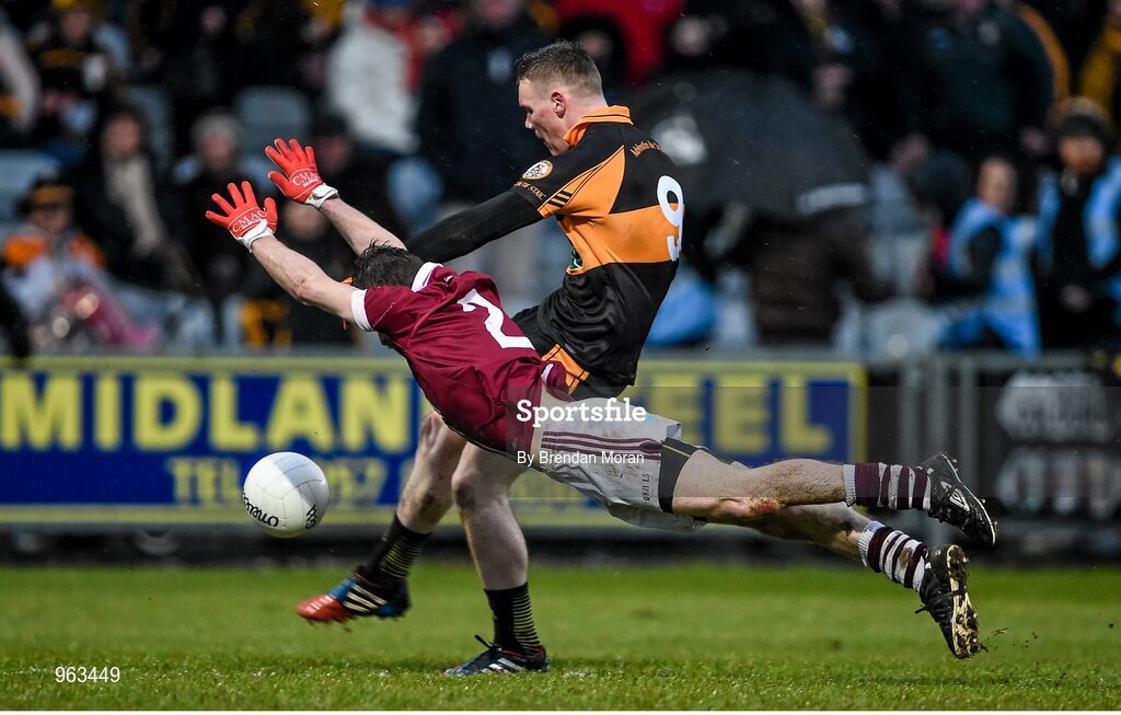 15 February 2015; Francis McEldowney, Slaughtneil, attempts to block a shot by Greg Horan, Austin Stacks. AIB GAA Football All-Ireland Senior Club Championship, Semi-Final, Austin Stacks v Slaughtneil, O'Moore Park, Portlaoise, Co. Laois. Picture credit: Brendan Moran / SPORTSFILE