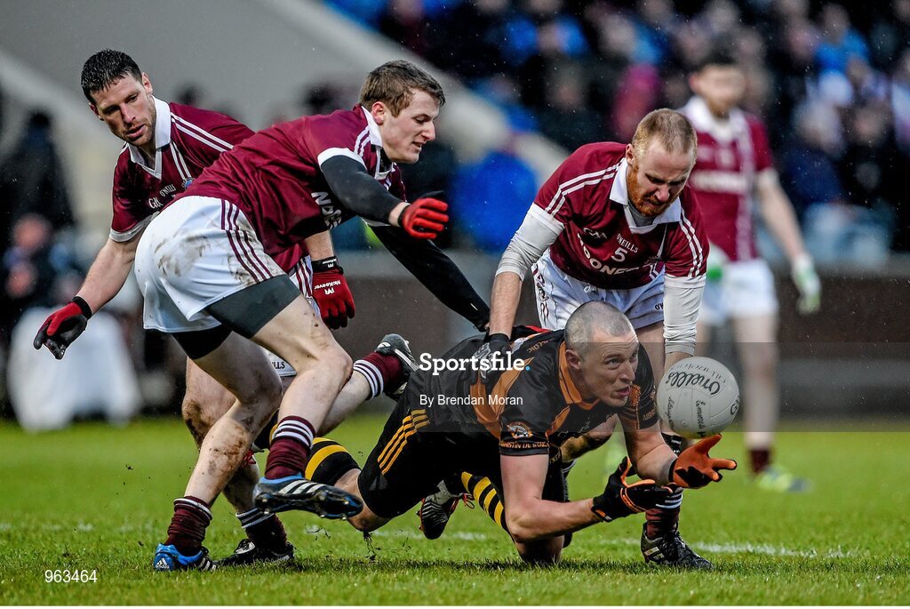 15 February 2015; Kieran Donaghy, Austin Stacks, under pressure from Slaughtneil players, from left, Barry McGuigan, Brendan Rogers and Conan Cassidy. AIB GAA Football All-Ireland Senior Club Championship, Semi-Final, Austin Stacks v Slaughtneil, O'Moore Park, Portlaoise, Co. Laois. Picture credit: Brendan Moran / SPORTSFILE