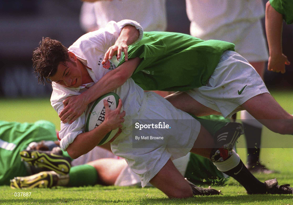 28 April 2000; Paul Hodgson of England dives over to score a try, despite being tackled by David Kelly of Ireland, during the 4 Nations U18 Championship match between Ireland and England at Lansdown Road in Dublin. Photo by Matt Browne/Sportsfile