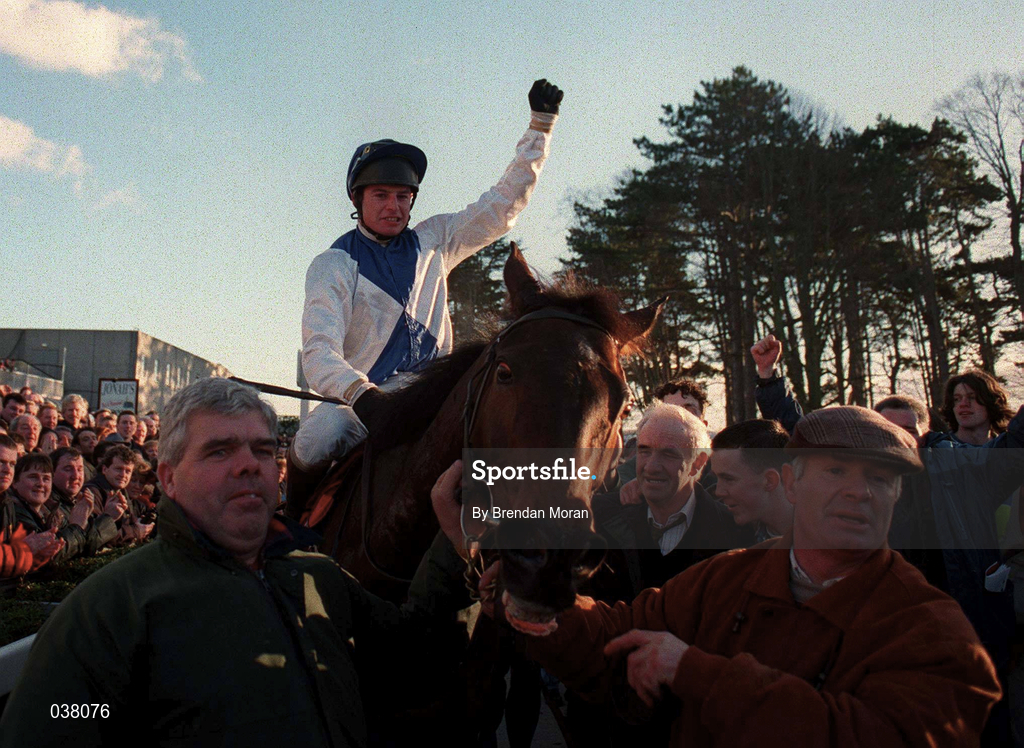 2 February 1997; Jockey Tommy Treacy celebrates as he is lead into the winners enclosure by trainer Thomas Foley, behind centre, after riding Danoli to victory in the Hennessy Cognac Gold Cup at Leopardstown Racecourse in Dublin. Photo by Brendan Moran/Sportsfile