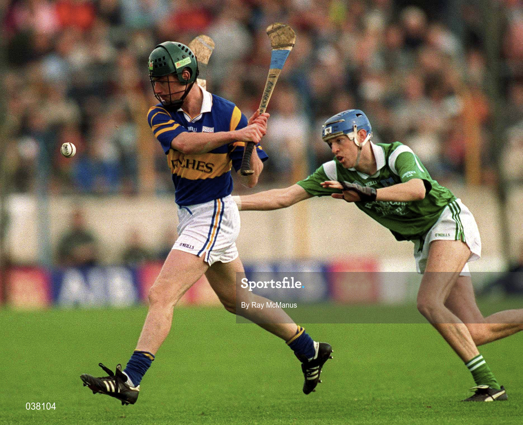 30 April 2000; David Kennedy of Tipperary in action against Mike O'Brien of Limerick during the Church & General National Hurling League Division 1 Semi-Final match between Tipperary and Limerick at Semple Stadium in Thurles, Tipperary. Photo by Ray McManus/Sportsfile