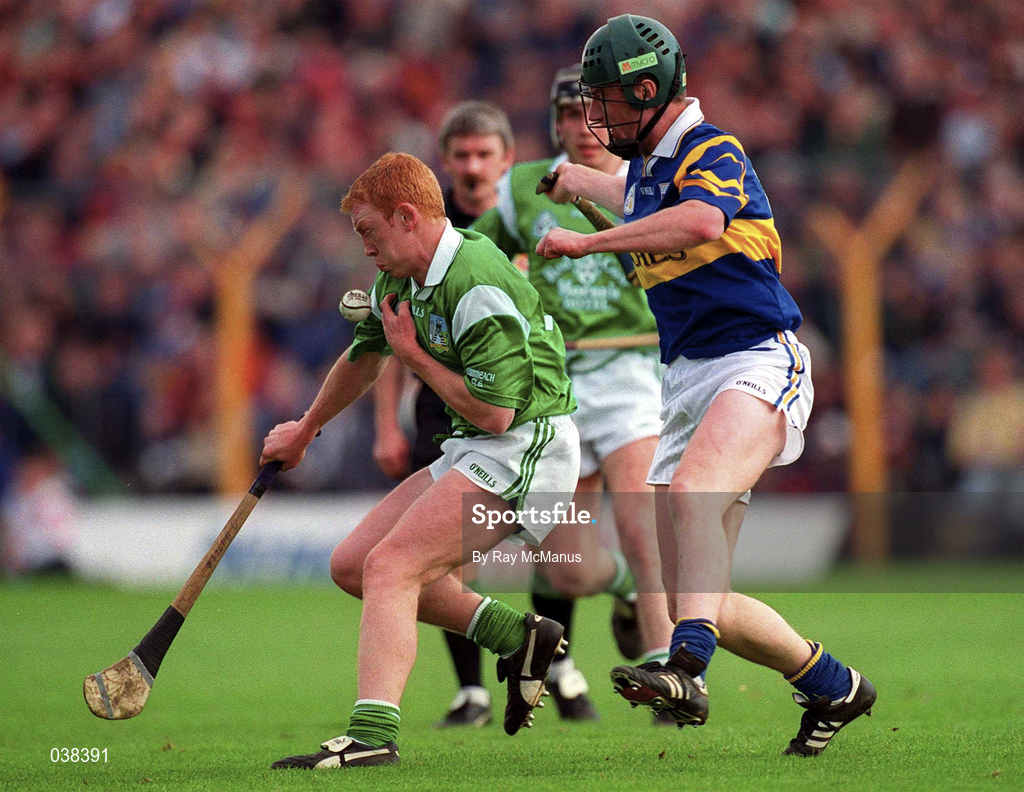 30 April 2000; James Butler of Limerick in action against David Kennedy of Tipperary during the Church & General National Hurling League Division 1 Semi-Final match between Tipperary and Limerick at Semple Stadium in Thurles, Tipperary. Photo by Ray McManus/Sportsfile