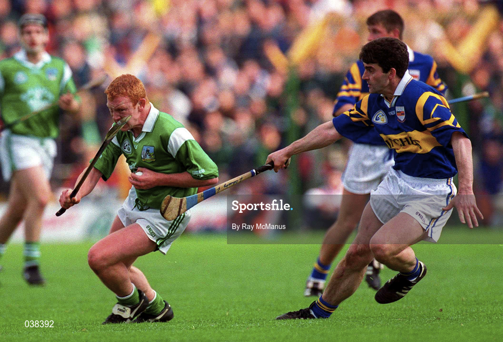 30 April 2000; James Butler of Limerick in action against Liam Sheedy of Tipperary during the Church & General National Hurling League Division 1 Semi-Final match between Tipperary and Limerick at Semple Stadium in Thurles, Tipperary. Photo by Ray McManus/Sportsfile