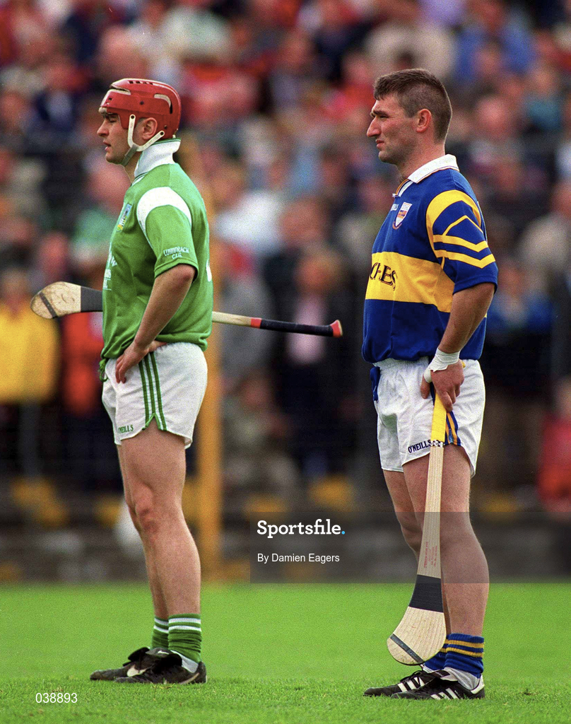 30 April 2000; TJ Ryan of Limerick and Paul Shelly of Tipperary stand for the national anthem prior to the Church & General National Hurling League Division 1 Semi-Final match between Tipperary and Limerick at Semple Stadium in Thurles, Tipperary. Photo by Damien Eagers/Sportsfile