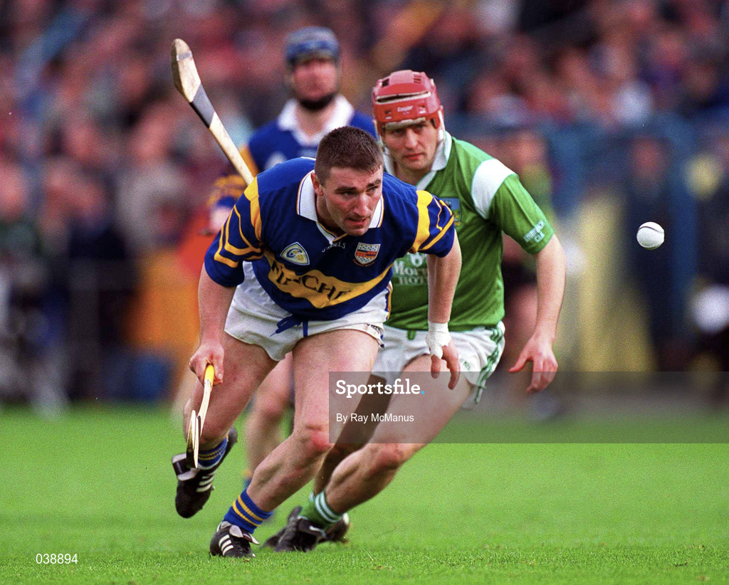 30 April 2000; Paul Shelly of Tipperary in action against TJ Ryan of Limerick during the Church & General National Hurling League Division 1 Semi-Final match between Tipperary and Limerick at Semple Stadium in Thurles, Tipperary. Photo by Ray McManus/Sportsfile