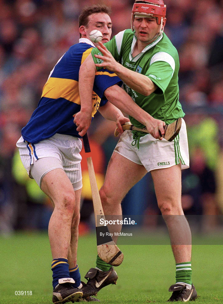 30 April 2000; TJ Ryan of Limerick in action against Andy Moloney of Tipperary during the Church & General National Hurling League Division 1 Semi-Final match between Tipperary and Limerick at Semple Stadium in Thurles, Tipperary. Photo by Ray McManus/Sportsfile