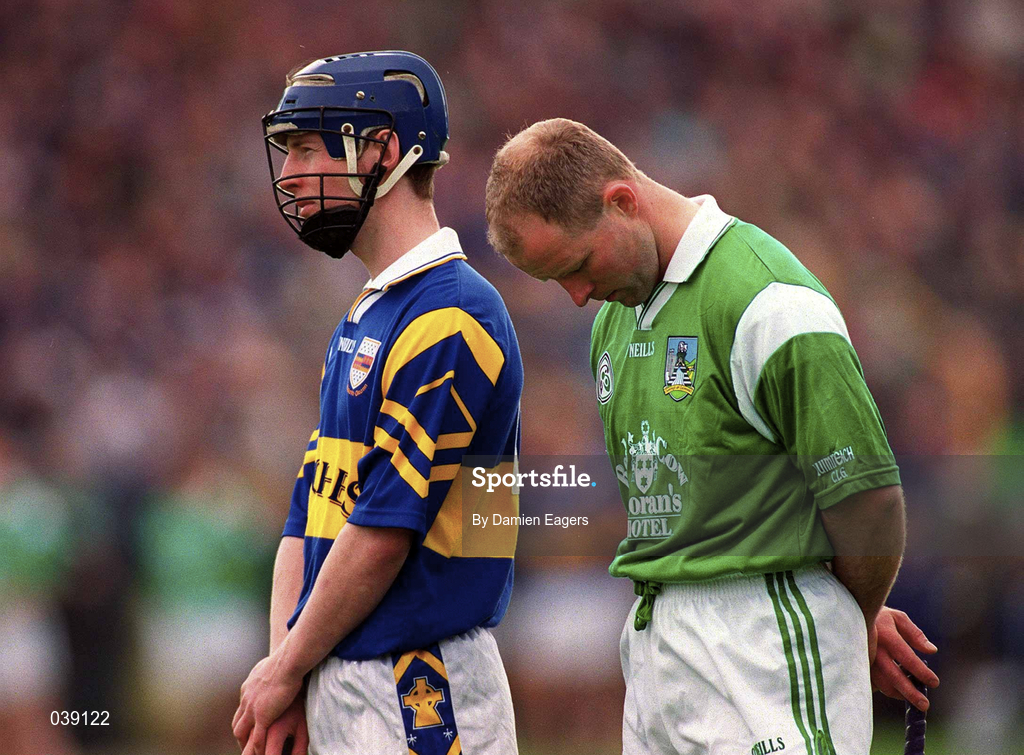 30 April 2000; Thomas Dunne of Tipperary and Stephen McDonagh of Limerick stand for the national anthem prior to the Church & General National Hurling League Division 1 Semi-Final match between Tipperary and Limerick at Semple Stadium in Thurles, Tipperary. Photo by Damien Eagers/Sportsfile