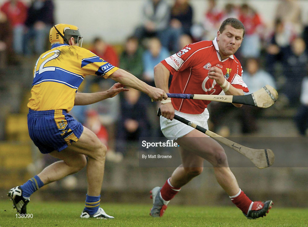 24 April 2004; Diarmuid O'Sullivan of Cork in action against Tony Griffin of Clare during the Allianz National Hurling League Group 1 Round 3 match between Cork and Clare at Páirc U’ Rinn in Cork. Photo by Matt Browne/Sportsfile