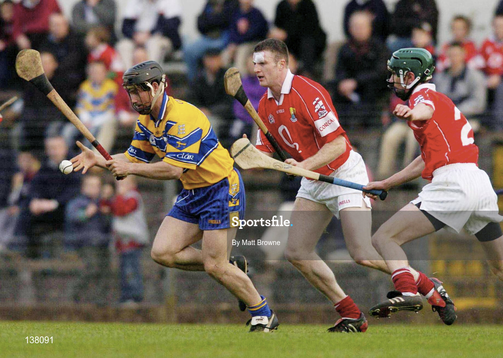 24 April 2004; David Forde of Clare in action against Graham Callinan, centre, and Brian Murphy of Cork during the Allianz National Hurling League Group 1 Round 3 match between Cork and Clare at Páirc U’ Rinn in Cork. Photo by Matt Browne/Sportsfile