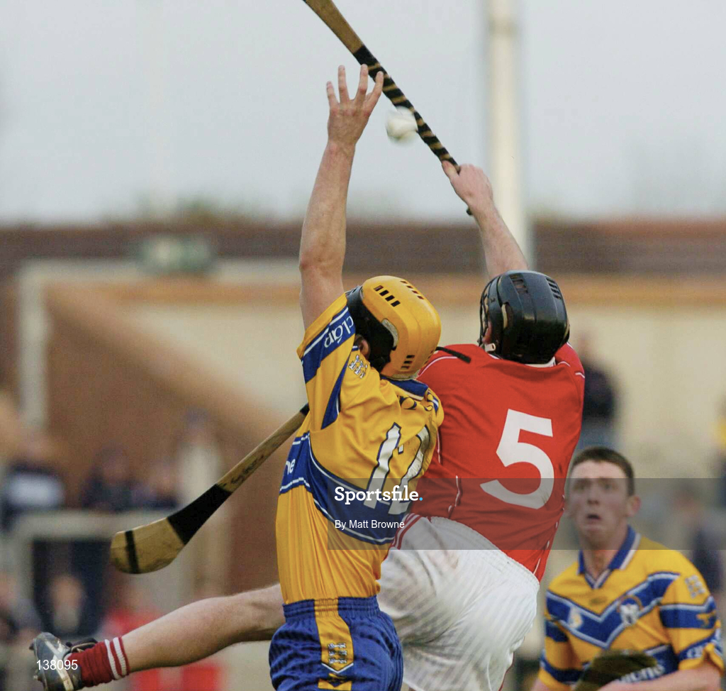 24 April 2004; Tony Griffin of Clare in action against Ian Kellagher of Cork during the Allianz National Hurling League Group 1 Round 3 match between Cork and Clare at Páirc U’ Rinn in Cork. Photo by Matt Browne/Sportsfile