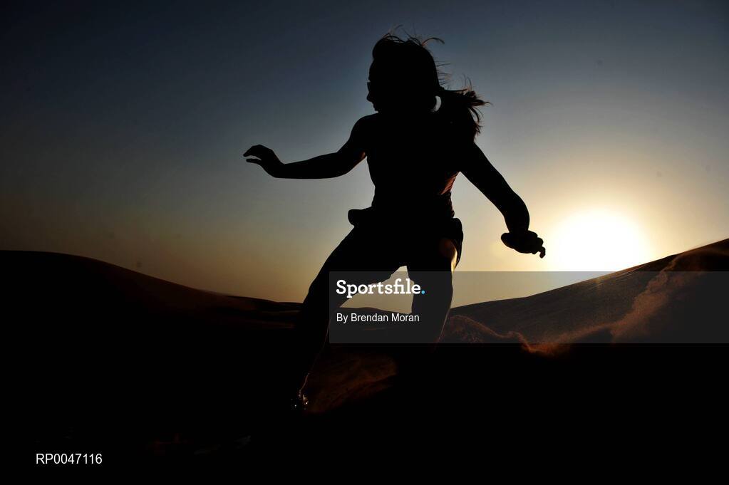 30 January 2008; Rebecca Hallahan, Waterford, enjoys the sandboarding during a Safari Trip. O'Neills/TG4 Ladies Gaelic Football All Star Tour 2007, Dubai, United Arab Emirates. Picture credit: Brendan Moran / SPORTSFILE  *** Local Caption ***
