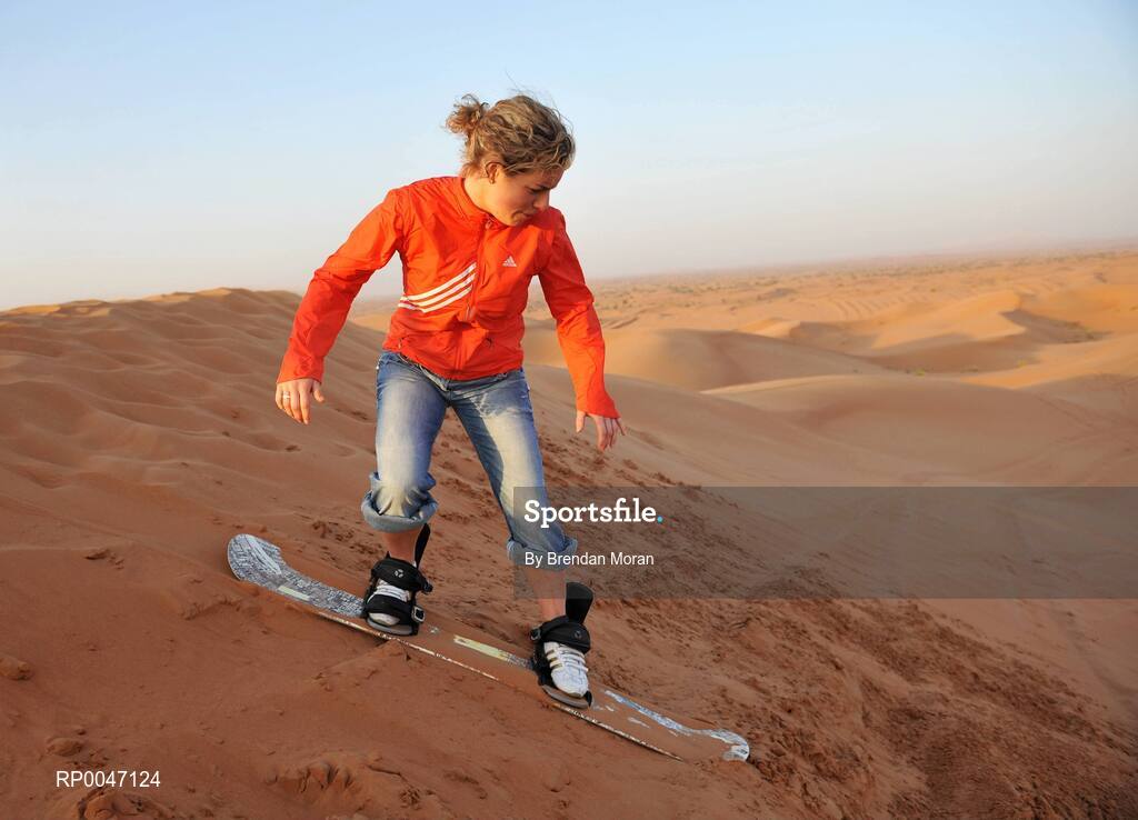 30 January 2008; Valerie Mulcahy, Cork, enjoys sandboarding down the sand dunes during a Safari Trip. O'Neills/TG4 Ladies Gaelic Football All Star Tour 2007, Dubai, United Arab Emirates. Picture credit: Brendan Moran / SPORTSFILE