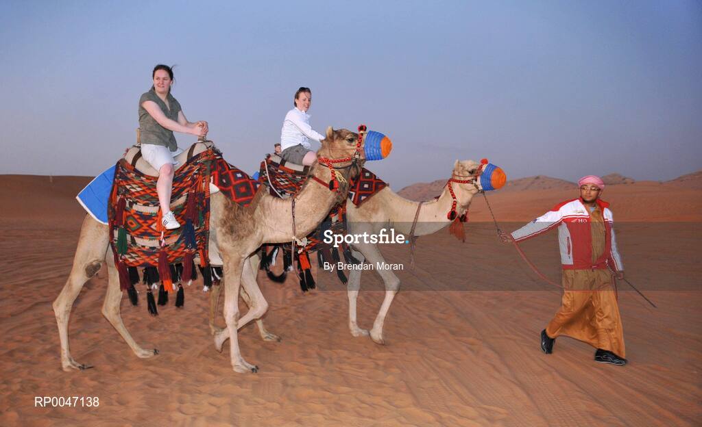 28 January 2008; Tyrone footballers Gemma Begley, left, and Cathy Donnelly try out some camel rides during a Safari Trip. O'Neills/TG4 Ladies Gaelic Football All Star Tour 2007, Dubai, United Arab Emirates. Picture credit: Brendan Moran / SPORTSFILE  *** Local Caption ***