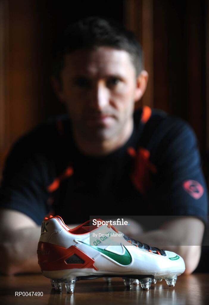 4 February 2008; Republic of Ireland captain Robbie Keane pictured with a pair of specially commissioned Republic of Ireland coloured Nike Total 90 Laser football boots which he will wear against Brazil on Wednesday the 6 February 2008. Portmarnock, Dublin. Picture credit: David Maher / SPORTSFILE