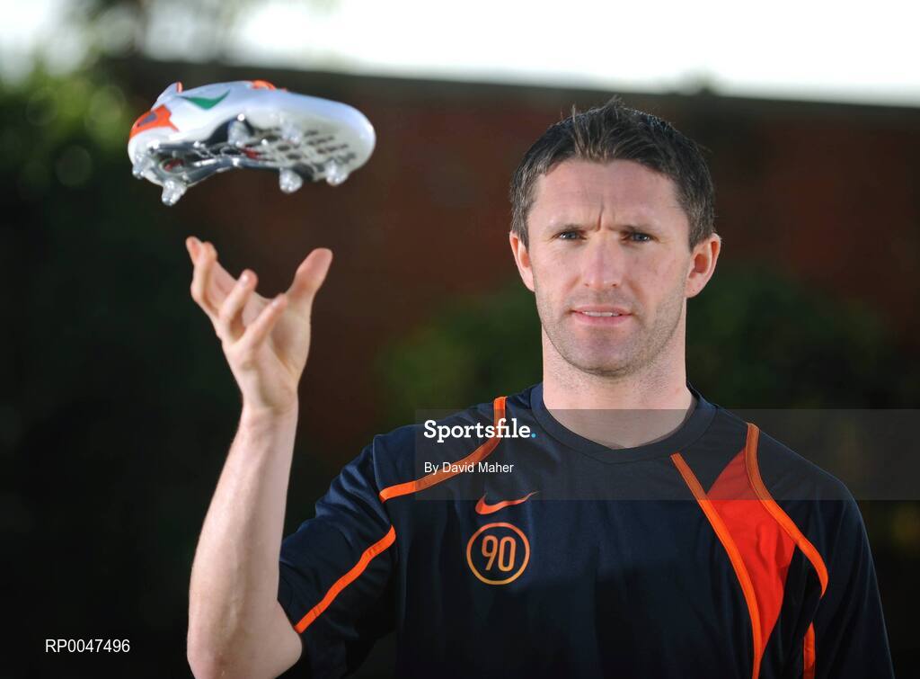 4 February 2008; Republic of Ireland captain Robbie Keane pictured with a pair of specially commissioned Republic of Ireland coloured Nike Total 90 Laser football boots which he will wear against Brazil on Wednesday the 6 February 2008. Portmarnock, Dublin. Picture credit: David Maher / SPORTSFILE  *** Local Caption ***
