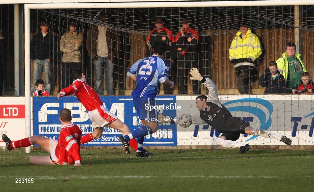 16 February 2008; Michael Hegarty, Dungannon Swifts, 25, scores the first goal against John Connelly, Cliftonville. Carnegie League Premier Division, Dungannon Swifts v Cliftonville, Stangmore Park, Dungannon, Co. Tyrone. Picture credit; Oliver McVeigh / SPORTSFILE