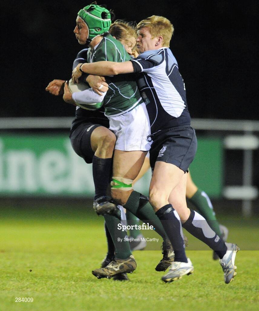 22 February 2008; Orla Brennan, Ireland, is tackled by Lynne Reid, right, and Louise Dalgiesh, Scotland. Women's Six Nations Rugby Championship, Ireland v Scotland, Templeville Road, Dublin. Picture credit: Stephen McCarthy / SPORTSFILE
