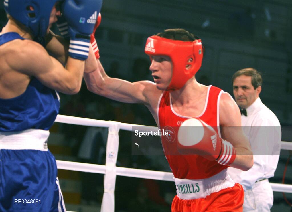 29 February 2008; Referee Teboa ZURAB, from Georgia, keeps a close eye as Ireland's John Joe Nevin, Cavan Boxing Club, lands a right on Maksym TRETYAK, Ukraine, on his way to qualify for the 54Kg final of the AIBA European Olympic Boxing Qualifing Tournament. The 18 year old from Mullingar also qualifies for the Beijing Olympics. Stadio Olympico, Pescara, Italy. Picture credit: SPORTSFILE