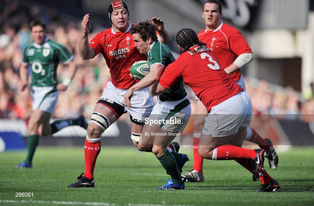 8 March 2008; Eoin Reddan, Ireland, is tackled by Adam Jones, 3, and Ian Gough, Wales. RBS Six Nations Rugby Championship, Ireland v Wales, Croke Park, Dublin. Picture credit: Brendan Moran / SPORTSFILE