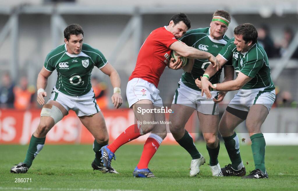 8 March 2008; Stephen Jones, Wales, is tackled by Jamie Heaslip and Marcus Horan, right, Ireland. RBS Six Nations Rugby Championship, Ireland v Wales, Croke Park, Dublin. Picture credit: Brendan Moran / SPORTSFILE