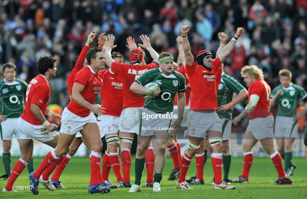 8 March 2008; Ireland's Jamie Heaslip is left in possession as the Wales players celebrate at the final whistle. RBS Six Nations Rugby Championship, Ireland v Wales, Croke Park, Dublin. Picture credit: Brian Lawless / SPORTSFILE