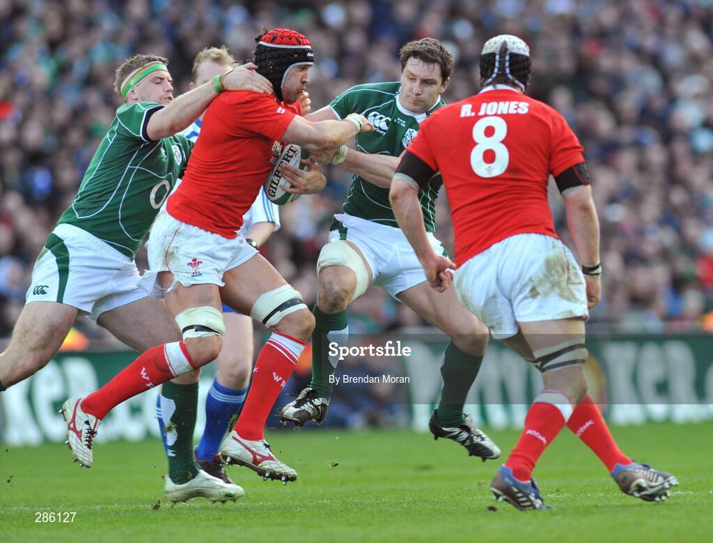 8 March 2008; Jonathan Thomas, Wales, is tackled by Ireland's Jamie Heaslip, left, and David Wallace. RBS Six Nations Rugby Championship, Ireland v Wales, Croke Park, Dublin. Picture credit: Brian Lawless / SPORTSFILE