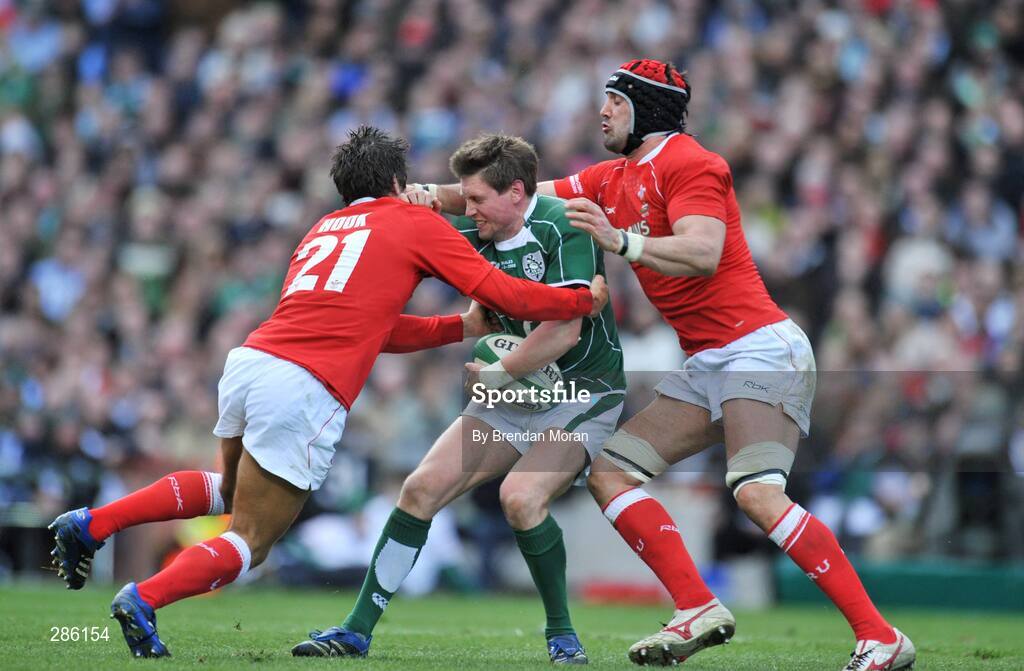 8 March 2008; Ronan O'Gara, Ireland, is tackled by James Hook, left, and Jonathan Thomas, Wales. RBS Six Nations Rugby Championship, Ireland v Wales, Croke Park, Dublin. Picture credit: Brendan Moran / SPORTSFILE